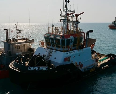 two tugboats on calm sea